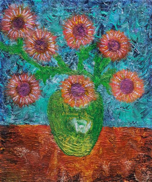 Orange flowers in a green vase
